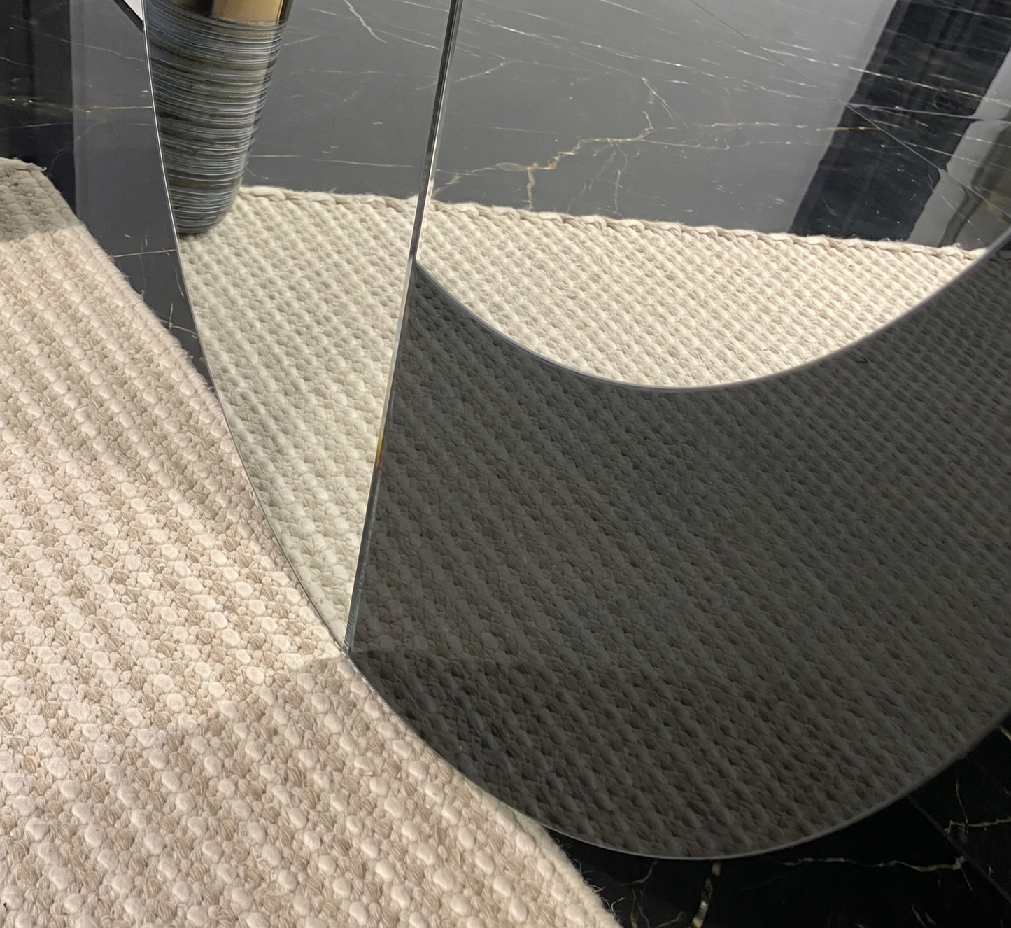 A large 138cm by 120cm Yin Yang shaped wall mirror.